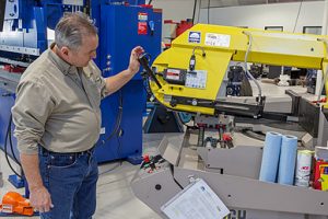 man working on machine tool maintenance